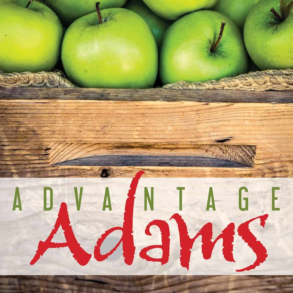 advantage adams sign showing apples in a crate